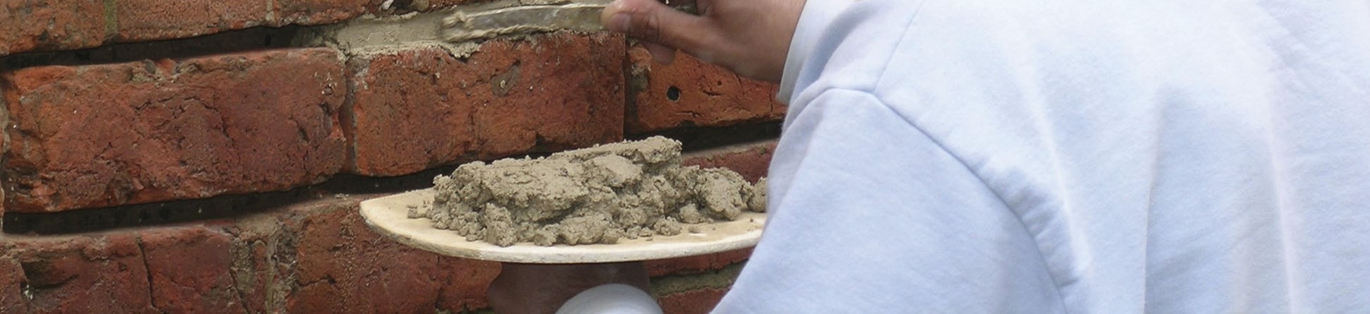 Man repointing brickwork