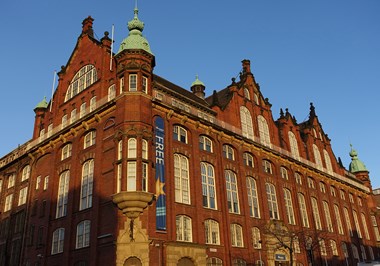 Red brick building situated on the corner of a street