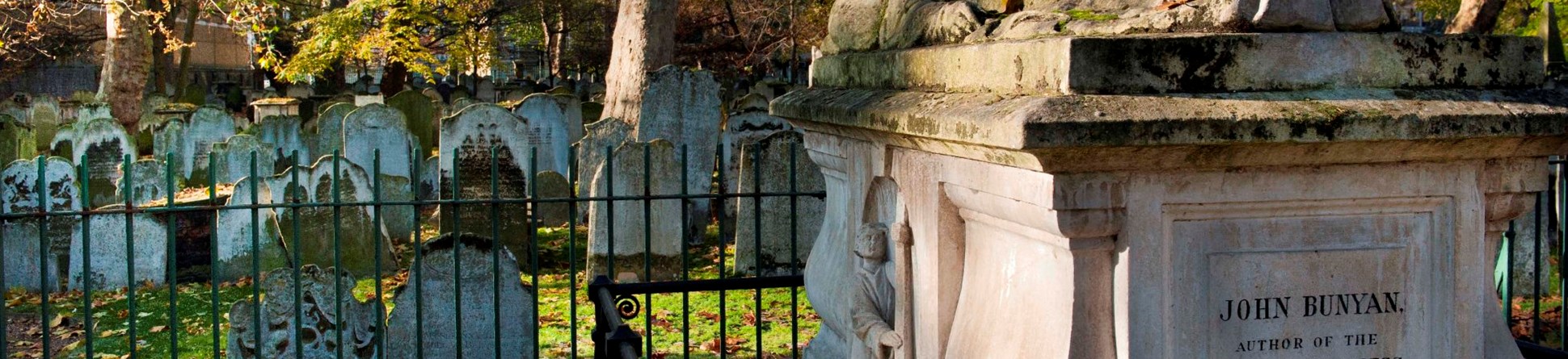 Bunhill Fields Burial Ground, City Road, Islington, London. Exterior showing John Bunyan’s stone-built tomb and gravestones.