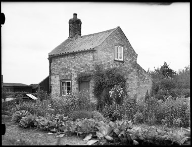 Archive photograph of vernacular buildings.